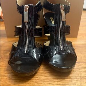 Michael Kors Black Patent Leather T‑Strap Zip Heels